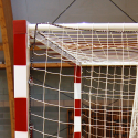 Aluminium handball goals with ground sockets and hinged base